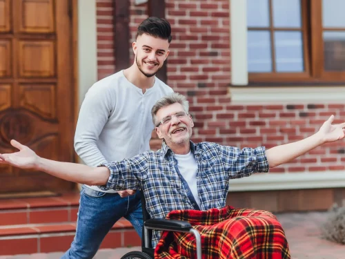 senior-father-wheelchair-young-son-walk