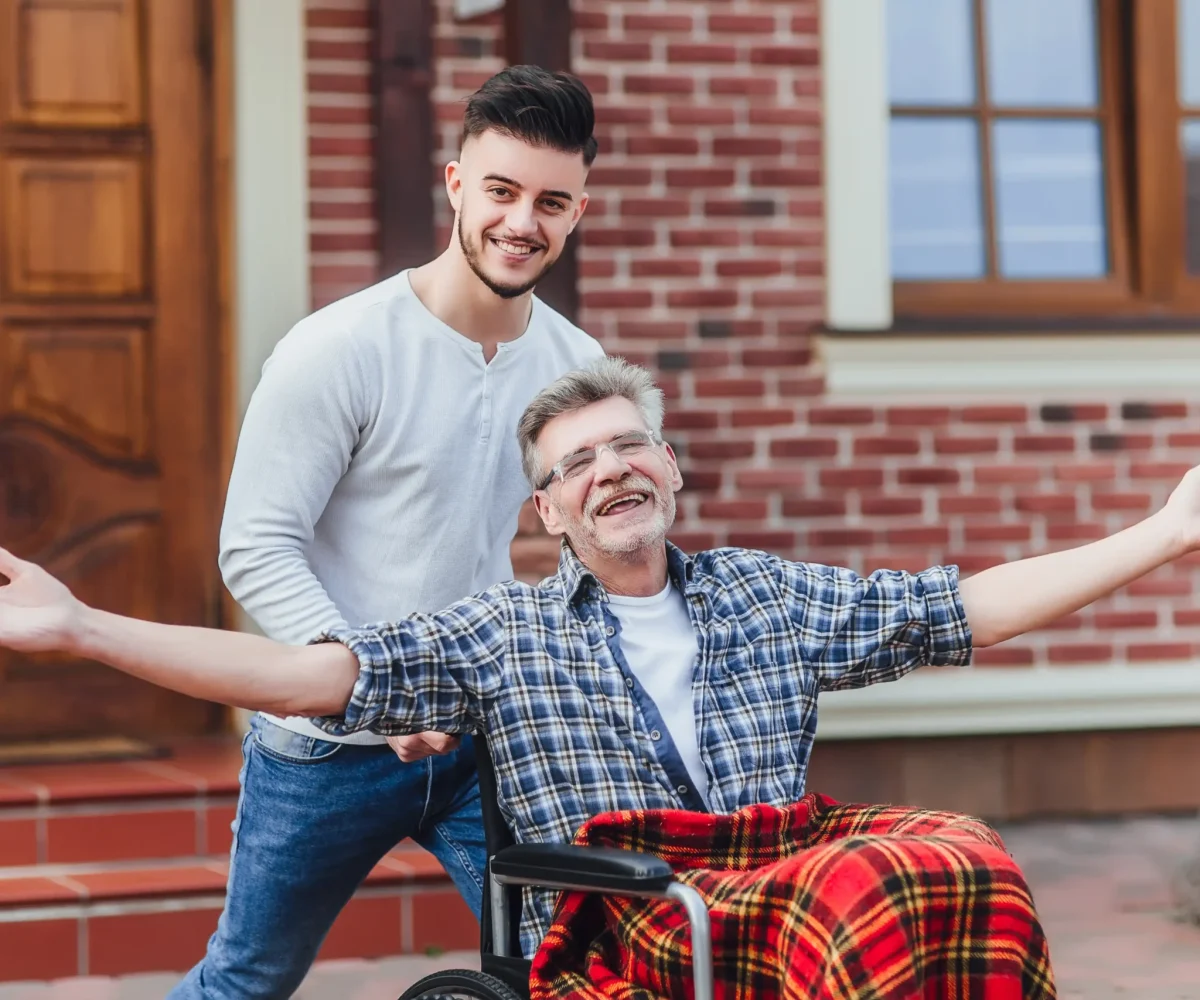 senior-father-wheelchair-young-son-walk
