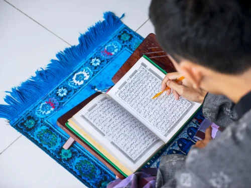 young-man-reading-quran-after-doing-salat