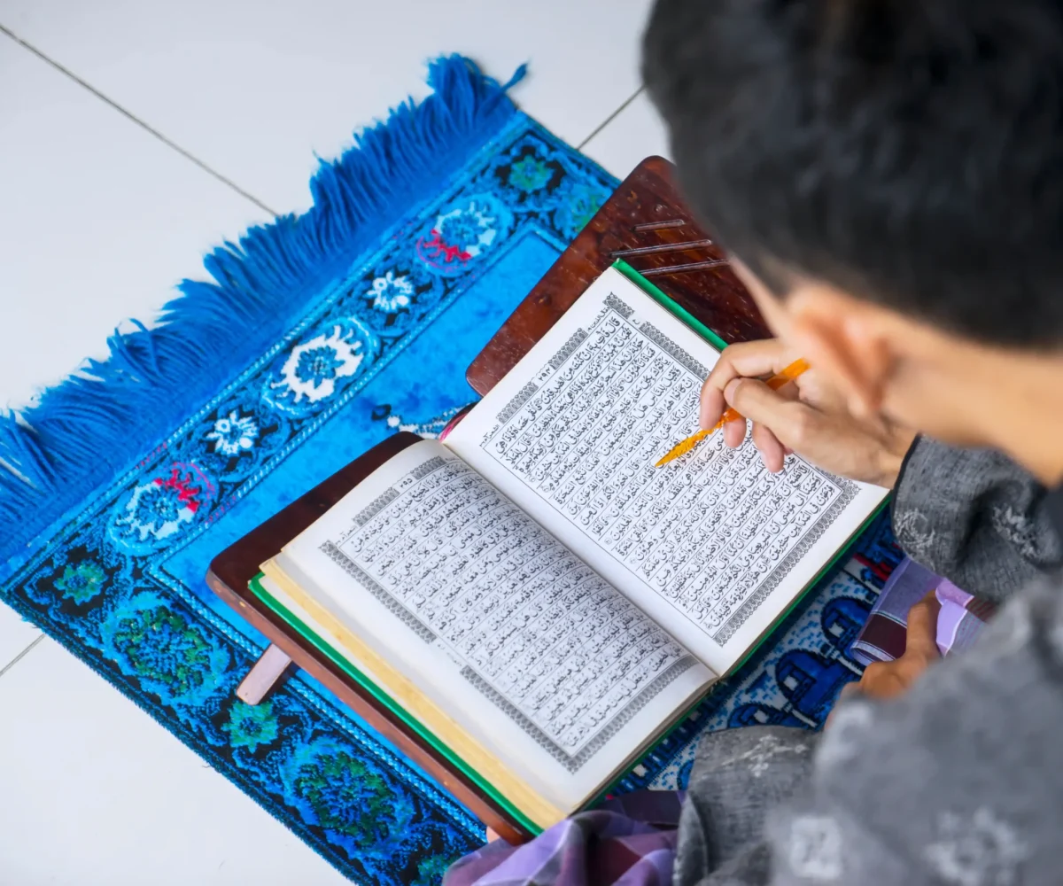 young-man-reading-quran-after-doing-salat